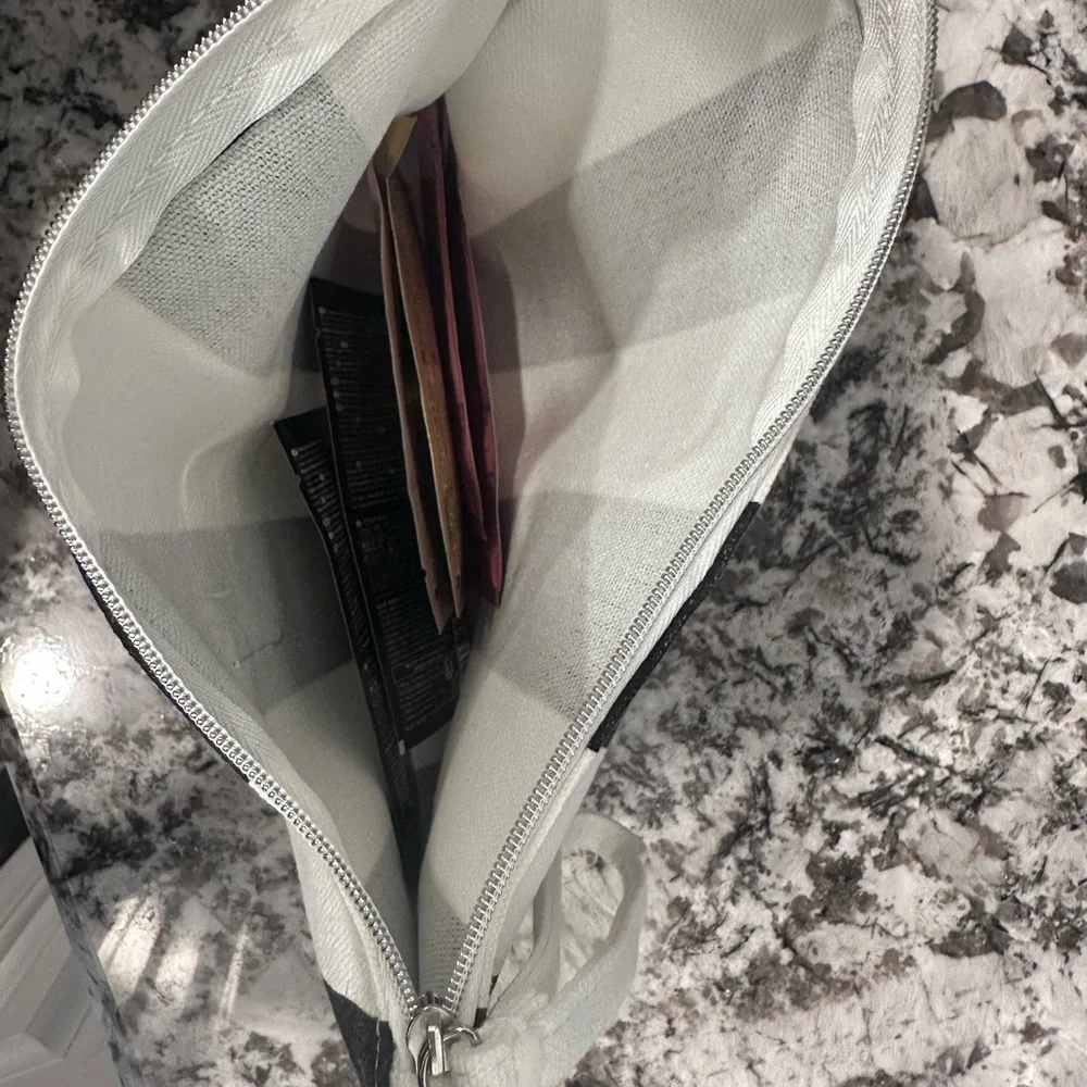 Kérastase Hair Care Set with Striped Black and White Clutch Zip Bag